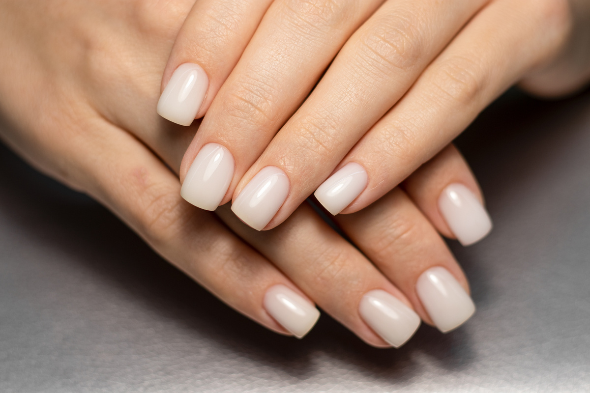Beautiful nude manicure. Short square nails. Nail design. Manicure with gel polish.